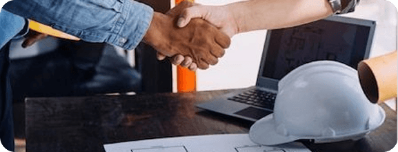 Professional handshake with hardhat symbolizing trusted NYC building inspection partnership